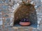 Flowerpot in a stonewall niche