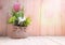 Flowerpot on wood table,Valentine`s day background.
