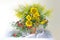 Flowers of beautiful sunflowers in a vase on a white background .Beautiful bouquet of sunflower wildflowers in a vase on a white