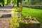 Flowers and bench in front of Hotel Palace and park in Sliac spa resort