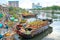 Flowers boat at flower market along canal wharf