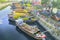 Flowers boats at flower market on along canal wharf