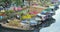 Flowers boats at flower market on along canal wharf