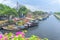 Flowers boats at flower market on along canal wharf