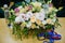 Flowers and a bottle of water on the table of the business conference participant. Bouquet on the site of the business training