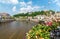 Flowers on a bridge across the Moselle River in Epinal, France