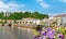 Flowers on a bridge across the Moselle River in Epinal, France