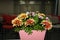 Flowers composition on table in empty conference room, office