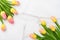 Flowers composition. Yellow flowers on marble background. Spring, 8 of march, woman day, mothers day, easter concept. Flat lay,