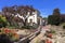 Flowers in Courtyard of City Hall with Old Monterey Jail and Colton Hall Museum in Background, Monterey, California, USA