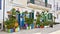 Flowers and flower supports at the entrance in a flower shop