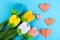 Flowers, hearts origami on blue background