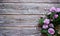 Flowers and leaves of rosehip Rosa majalis Herrm in a basket on a wooden background.