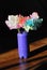 Flowers made of crepe paper in a vase.