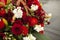 Flowers on memorial. Details of funeral decoration. Bouquet of flowers on grave