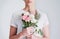 Flowers are natures gifts for the heart. Studio shot of an unrecognizable woman holding a bunch of flowers against a