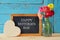 Flowers next to blackboard. happy mother\'s day concept