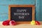 Flowers next to blackboard. happy mother\'s day concept