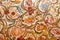 Flowers and patterns on painted textile from Sicily. Design of silk carpet from 17th century. Italian vintage