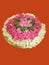 Flowers pile and heap in a orange background. Pile consists of a tulsi leaves, ganagale, lotus and sugandaraja flower