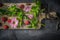 Flowers , raspberries and mint on the wooden board