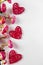 Flowers and red hearts on a white background for Valentine`s Day