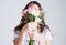 Flowers represents the delicate beauty of a woman. Studio shot of an unrecognizable woman covering her face with flowers