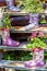 Flowers in a rubber floral knee boot for garden decoration