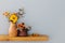 flowers in rustic ceramic vase on background gray wall