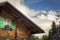 Flowers in rustic chalet at springtime with mountains, Interlaken, Switzerland