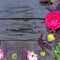 Flowers in a semicircle on a wooden background. Postcard for the holiday. Roses, geraniums, lavender, sage and hairy