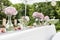 Flowers settings decoration outdoor setup for wedding with pink colored flower