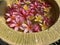 Flowers soaks in water in a pottery bowl. Onam and Diwali festival concept image, red plumeria flower or bunga kemboja merah in