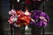 Flowers are sold on street. Artificial flowers for cemetery. Details of flower shop. Flowers made of plastic