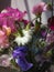 Flowers Still life. Beautiful colorful bouquet on moody background. Stylish artistic composition of lathyrus, love in the mist,