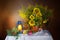 Flowers of a sunflower in vase isolated on dark background.Beautiful bouquet of sunflowers and Rowan berries,a kerosene Lamp