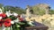 Flowers on a table with castle ruins behind