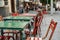 Flowers tables and chairs of an outdoor cafe in europe