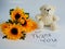 flowers and teddy bear with handwritten thank you paper notes