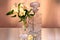 Flowers in the vase and the crystal bottle