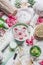 Flowers in water bowl and various beauty wellness, spa and massage accessories setting on white background