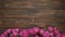 Flowers on wooden board with copy space for text, still life of roses on background