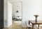 Flowers on wooden table in white flat interior with lamp above b