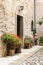 Flowery entrance of a house in medieval village of Cornello dei Tasso