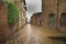 Flowery streets on a rainy spring day in a small magical village Pienza