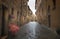 Flowery streets on a rainy spring day in a small magical village Pienza