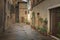 Flowery streets on a rainy spring day in a small magical village Pienza