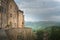 Flowery streets on a rainy spring day in a small magical village Pienza with a view to the Tuscan valley, Tuscany