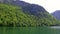 Flowing boat on the lake Konigssee in Germany in spring, the Alps