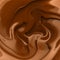 Flowing brown chocolate swirl